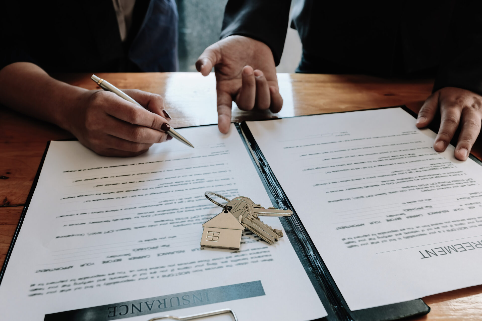 real estate agent offer hand for customer sign agreement contract signature for buy or sell house. real estate concept contact agreement concept selective focus.