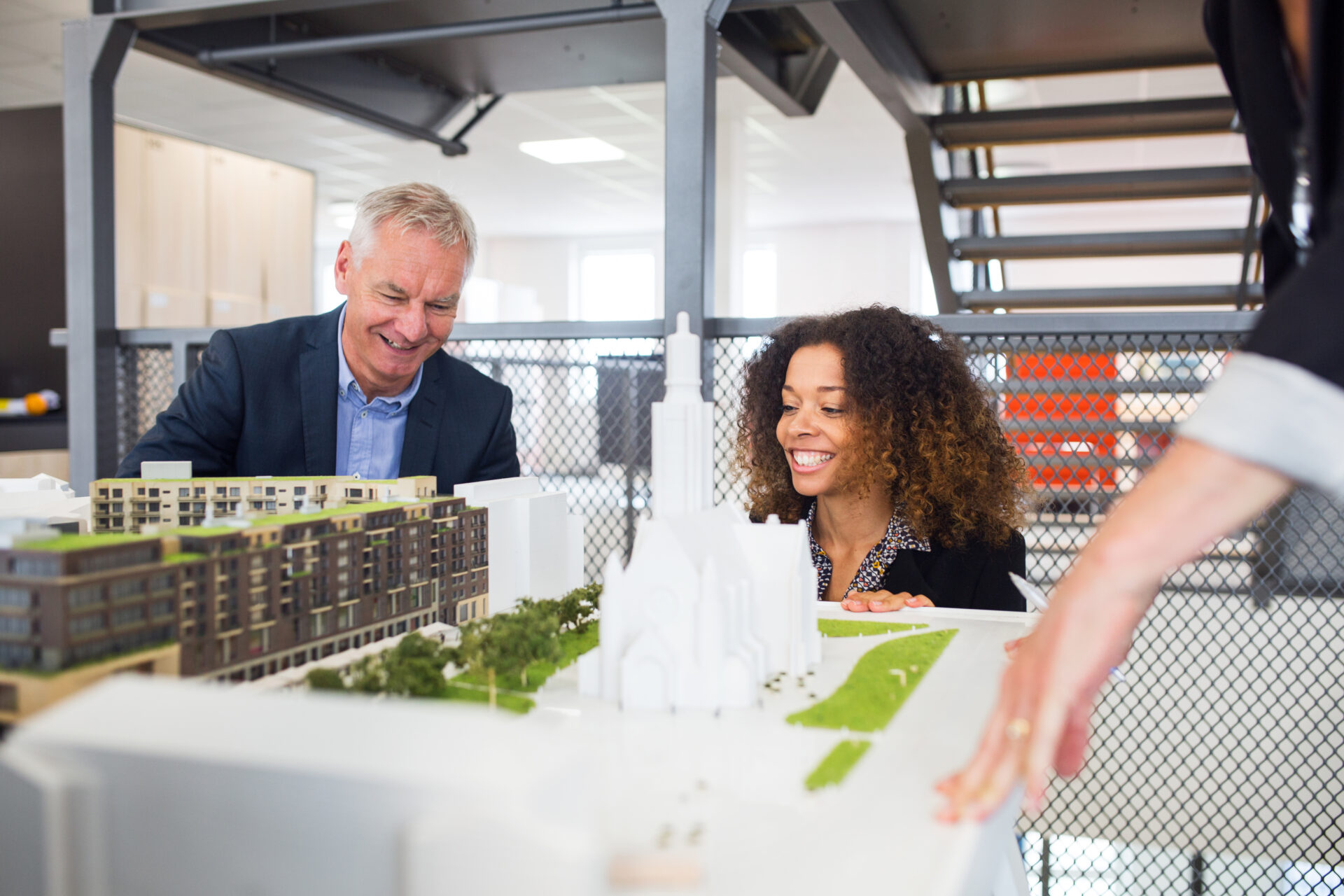 architects looking at model in office