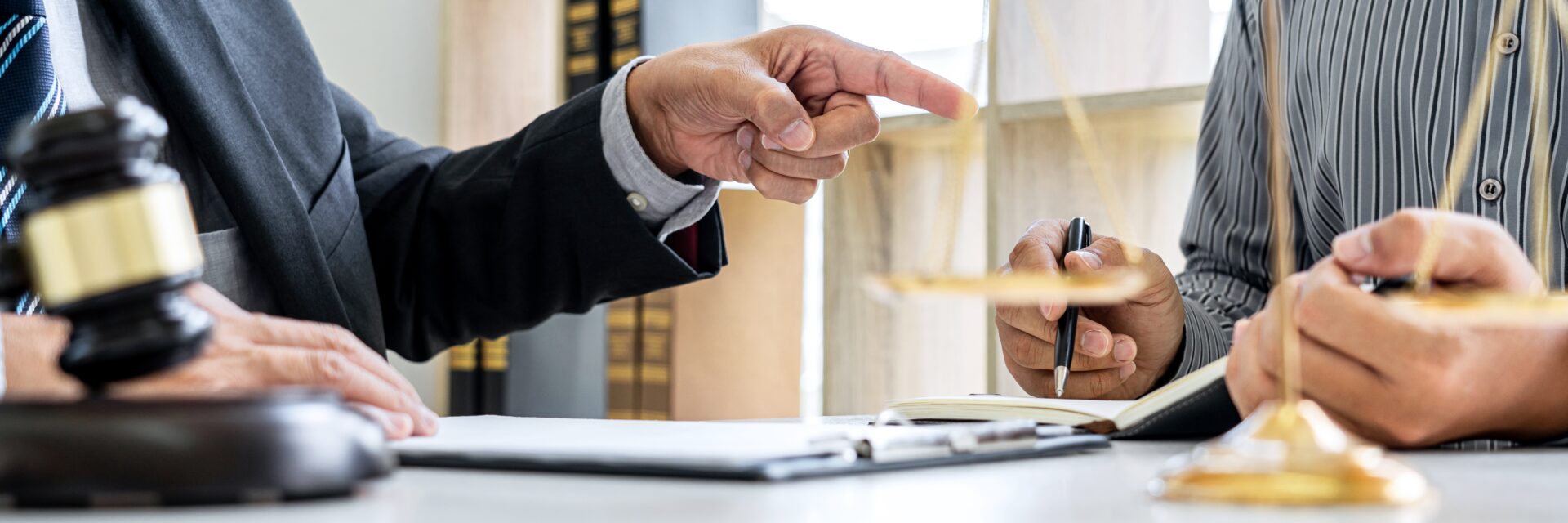 Male lawyer or Counselor working in courtroom have meeting with client are consultation with contract papers of real estate, Law and Legal services concept.