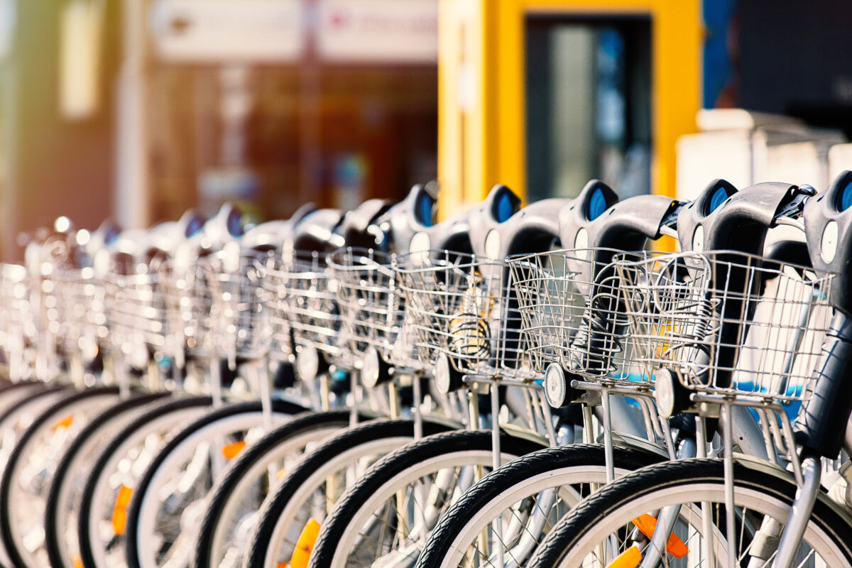 Micromobility property value enhancement. A row of bicycles parked