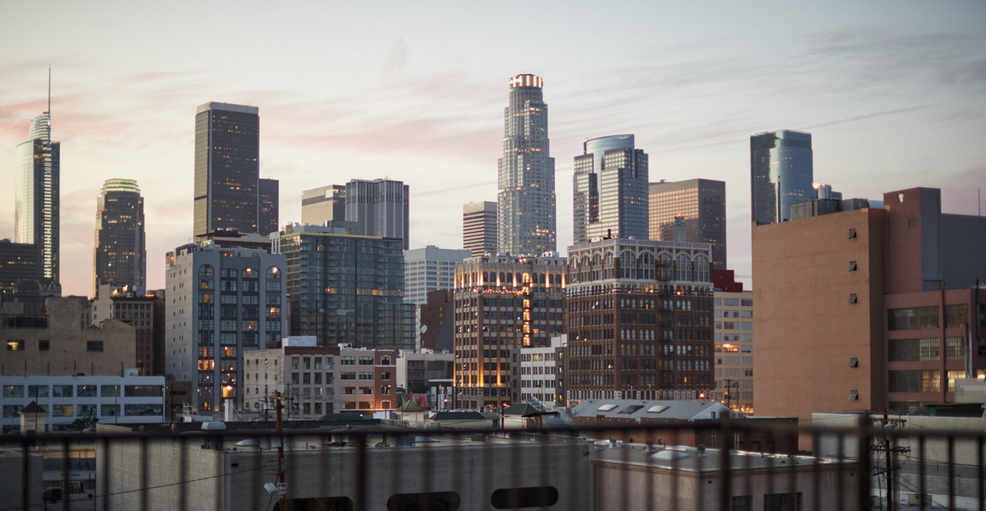 Westside vs Eastside LA: A Commercial Real Estate Comparison view of los angeles skyline at sunset